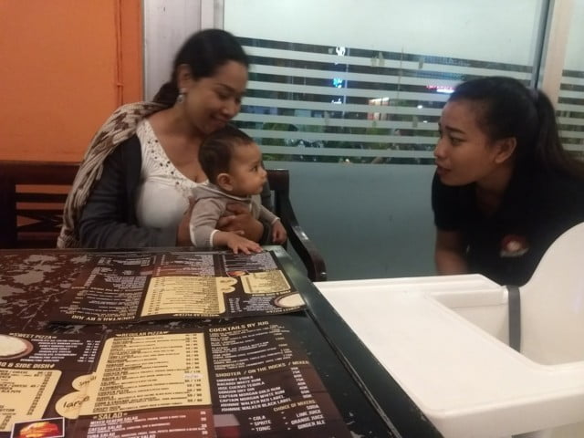 In Bali restaurant with a baby already getting special attention