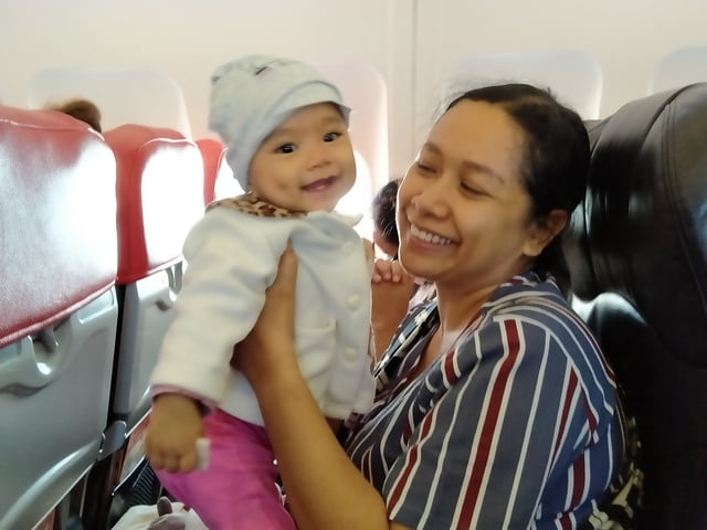 smiling baby on airasia flight