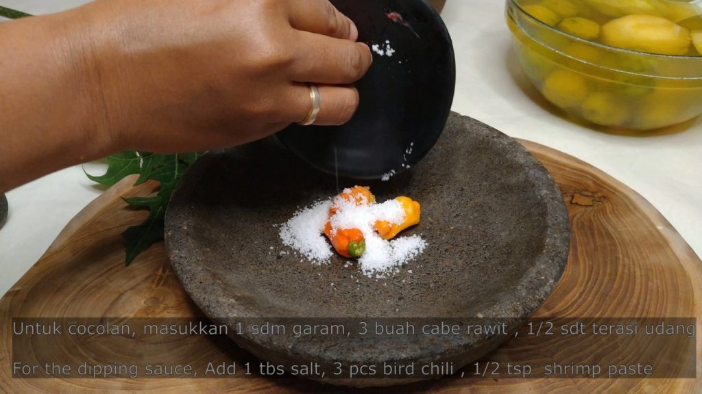 making spicy chili dip for kedondong